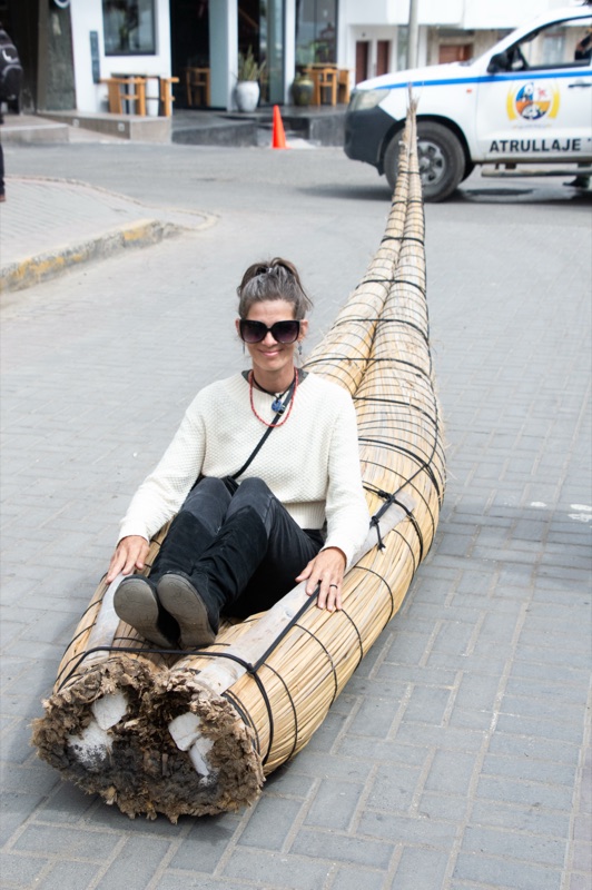 April sitting on a caballito de totora reed boat in Peru