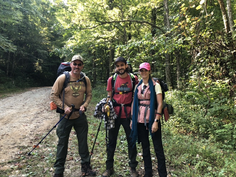 Backpacking with family on a wooded trail